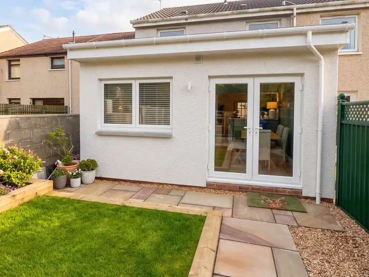 Single storey extension in white render with French doors, Troon